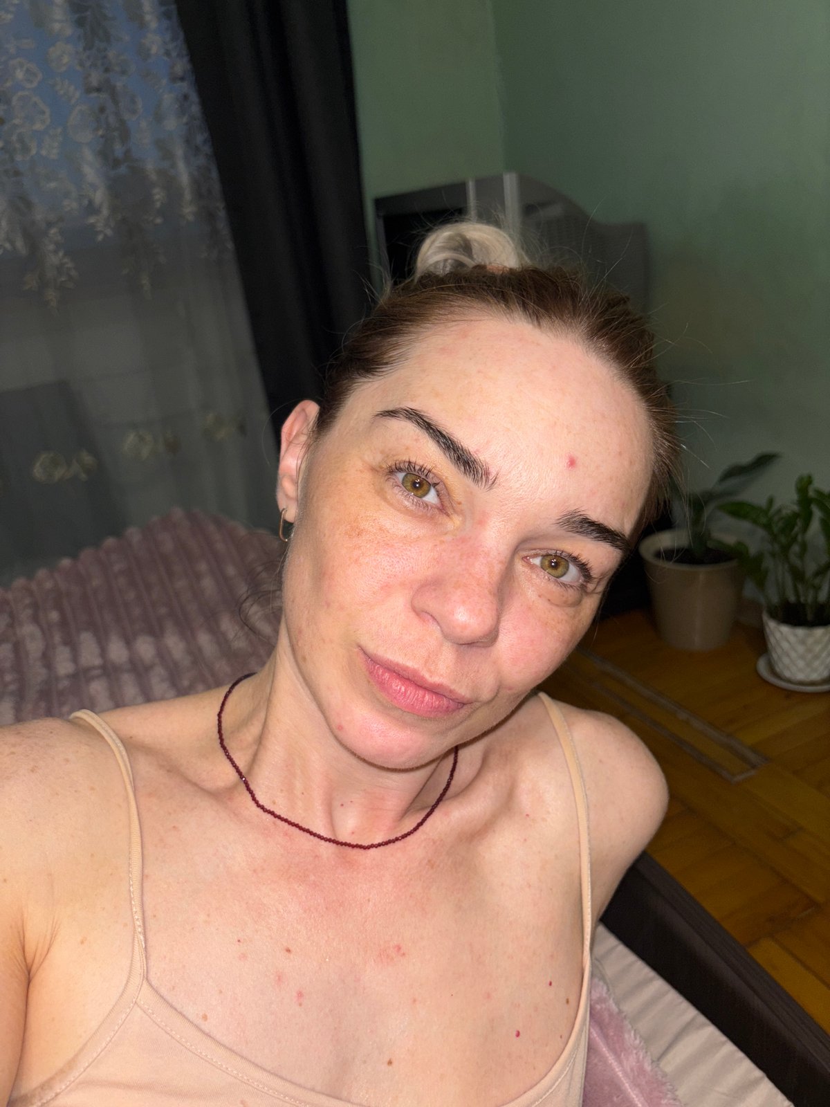 Cozy home evening with a cat, selfies, and cards.