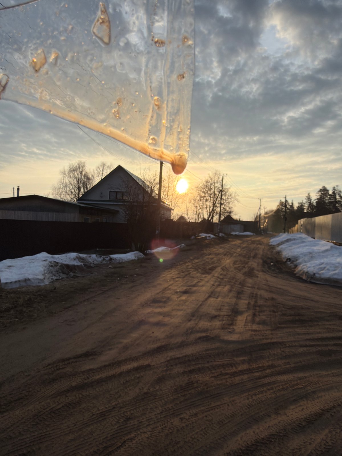 Spring ice formations documented in Chaikovsky, Russia during sunrise