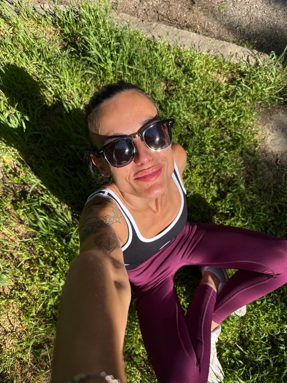 Woman films selfie, holds playing card in Pleven neighborhood