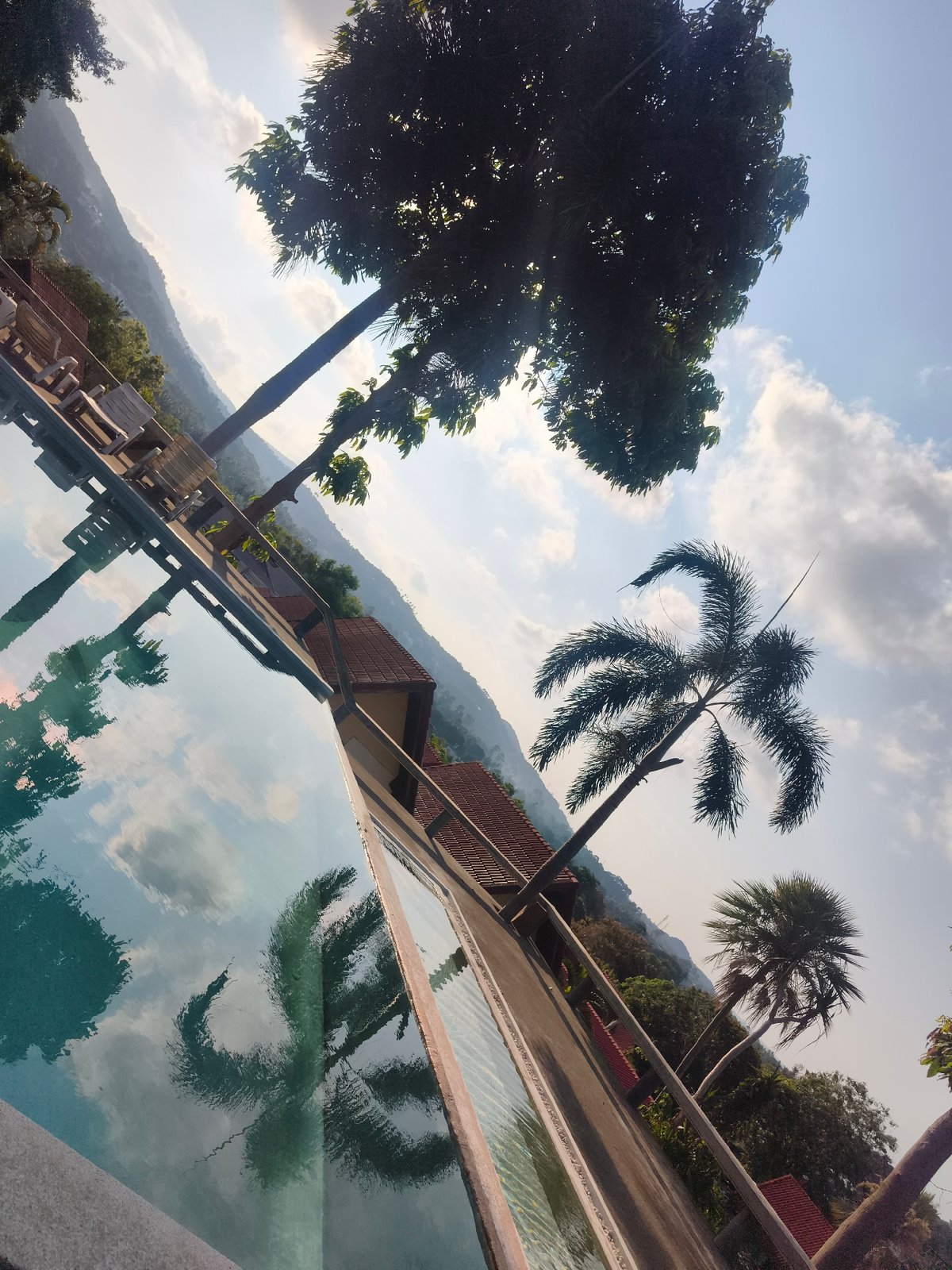 Child swims in outdoor pool in บ้านบางรักษ์, Thailand