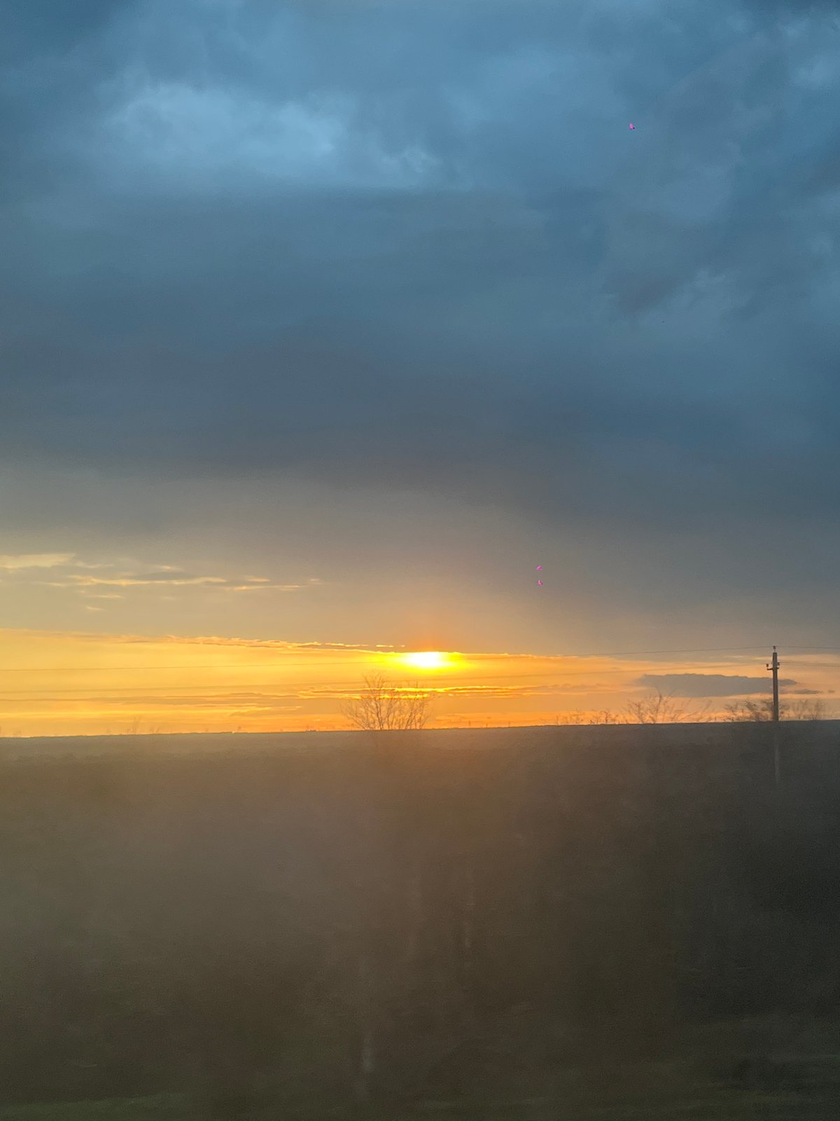 Dramatic sunset captured from moving vehicle in rural Russia