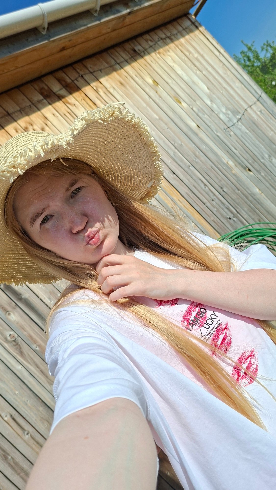 Woman in lucky shirt photographed on deck in Russia