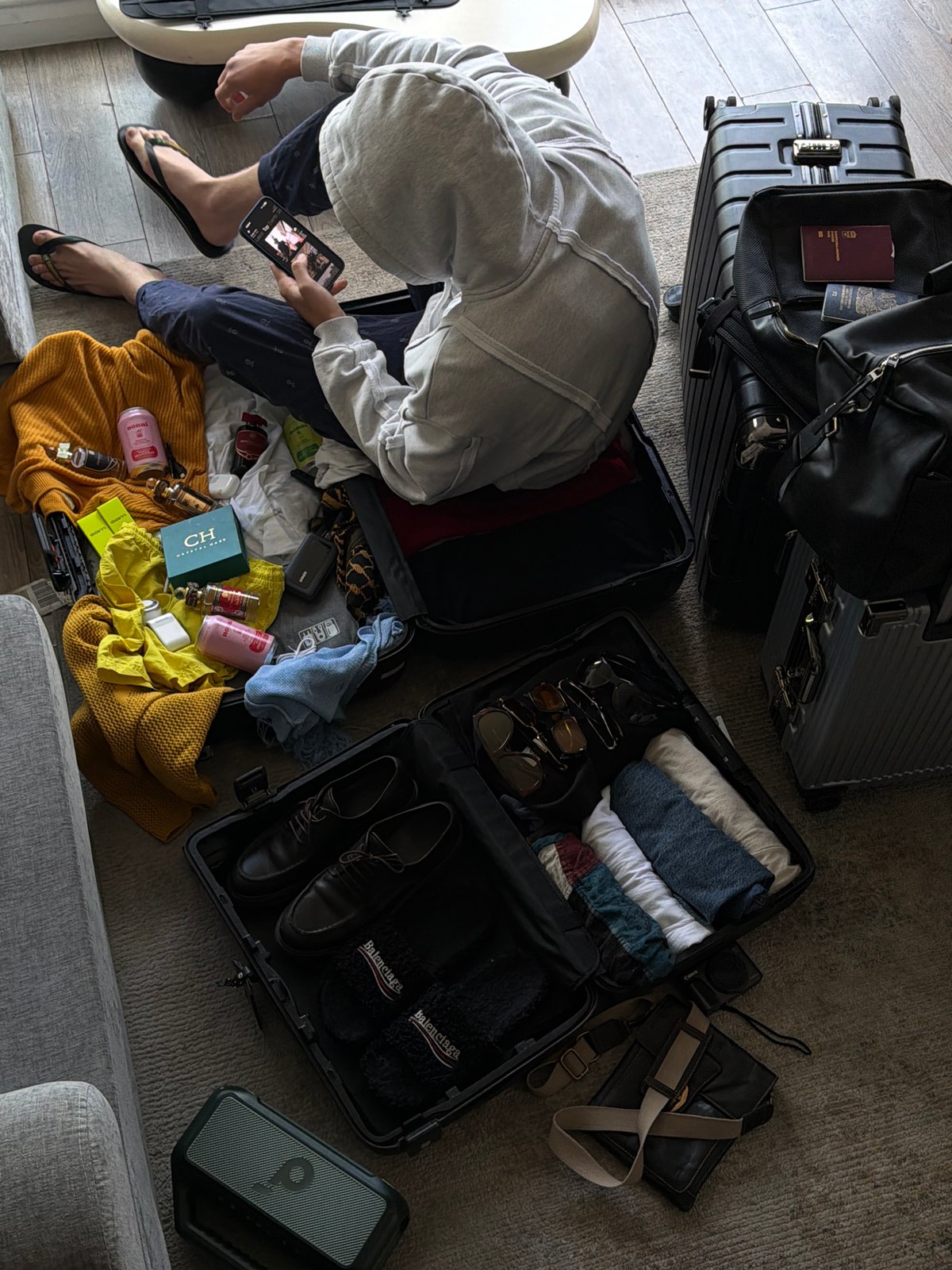 Packing or unpacking in London, travel items laid out