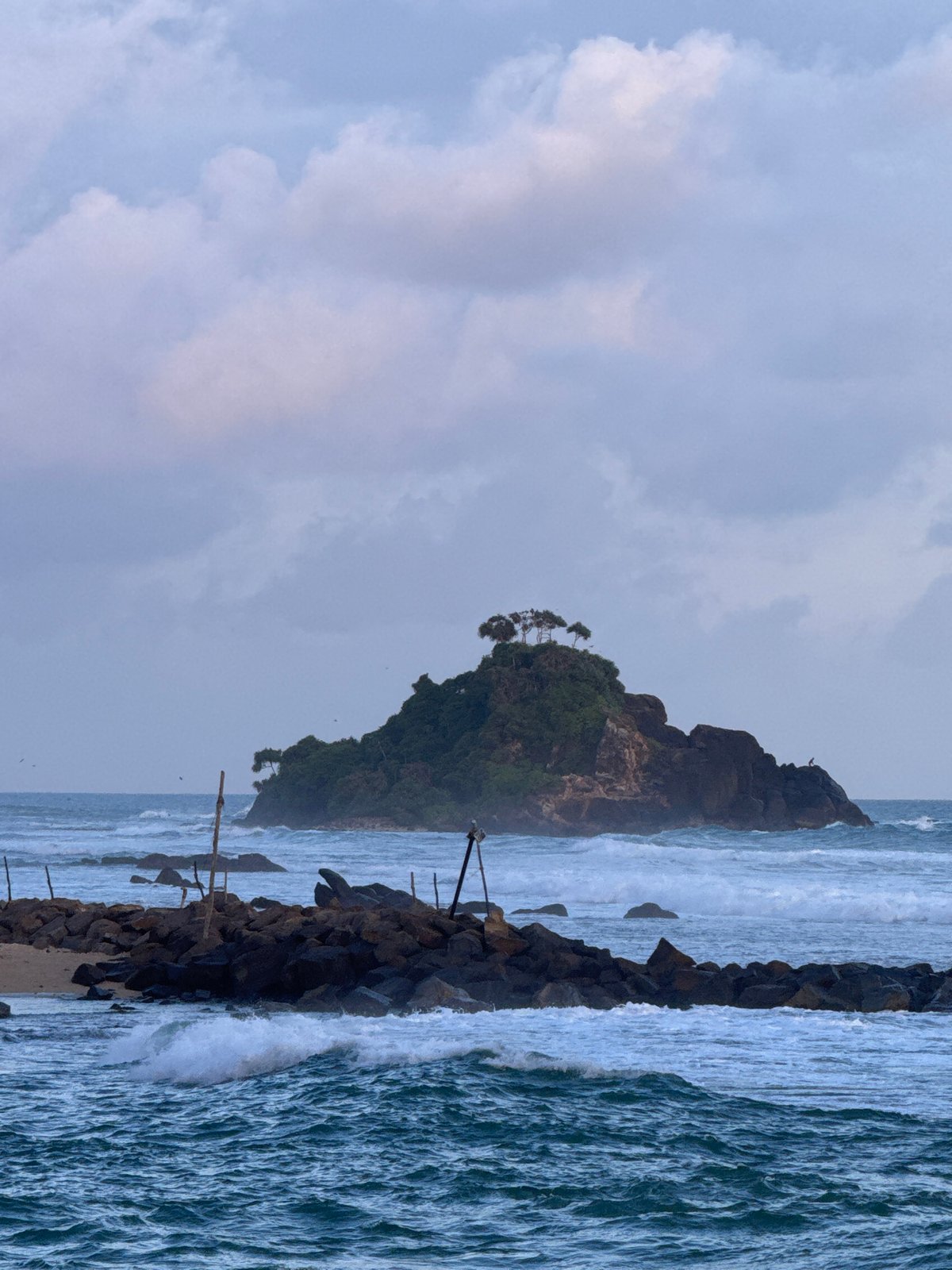 Sri Lanka's southern coast at golden hour — surf, palms, and village life