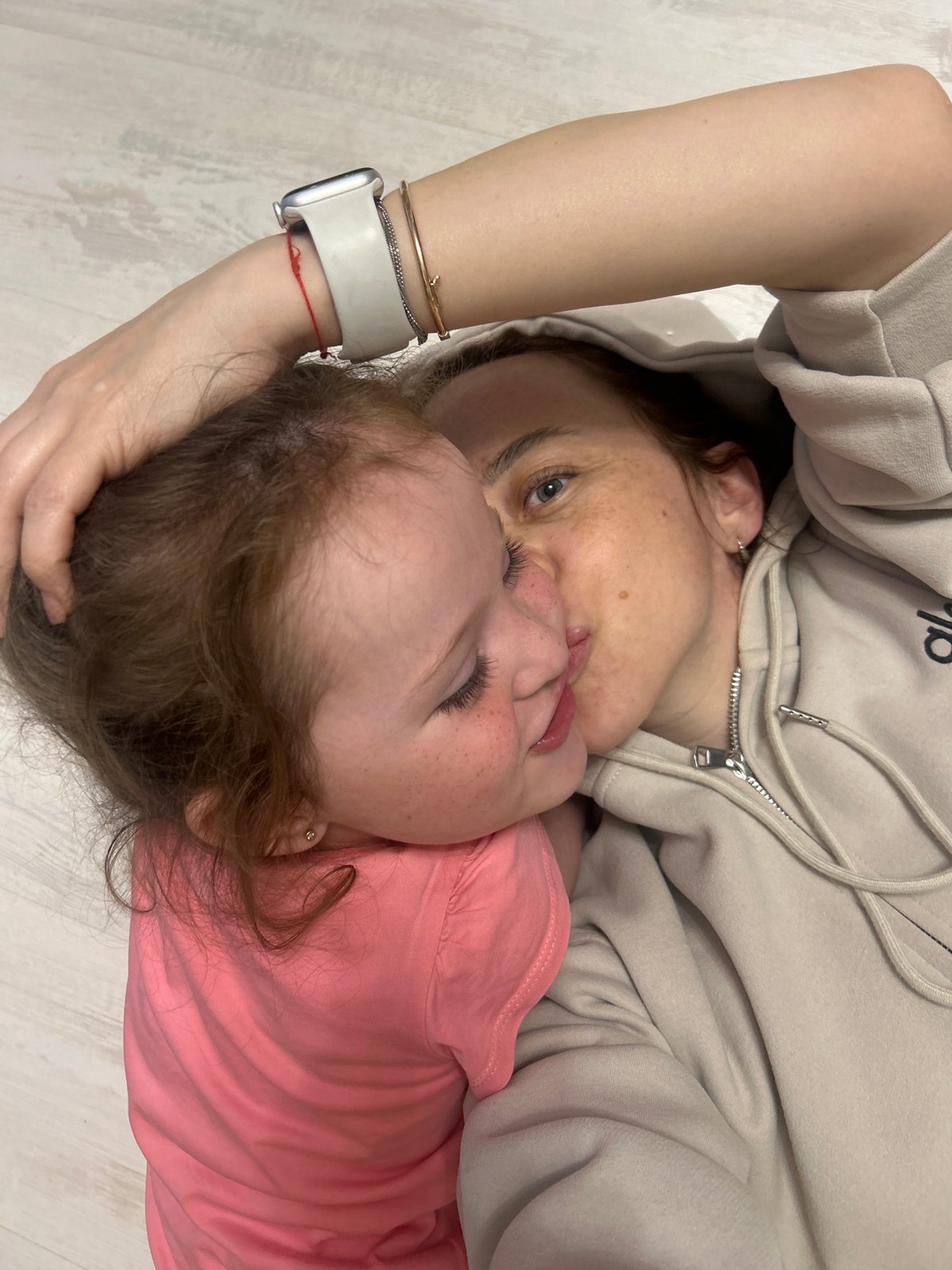 Adult and child share close moment in Chaikovsky