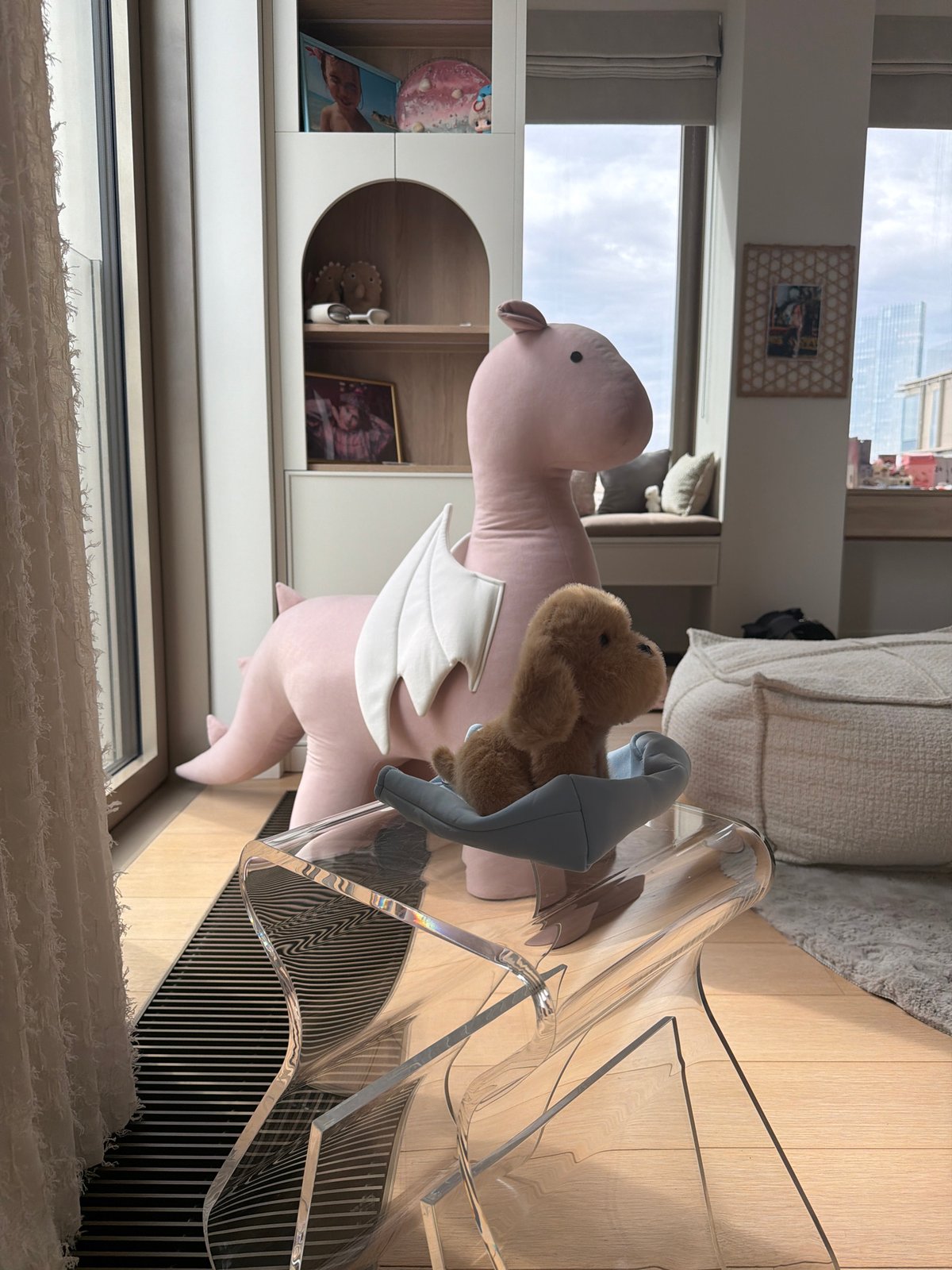 Stuffed dragon and bear spotted on chair in Moscow room