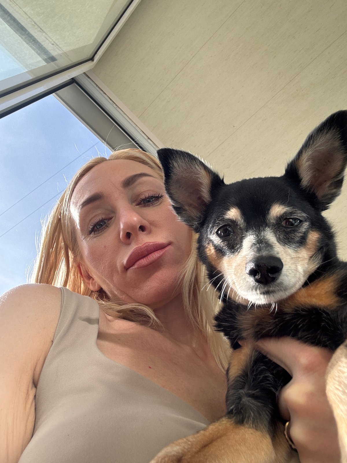 Woman, child, dog photographed together in Russian urban setting