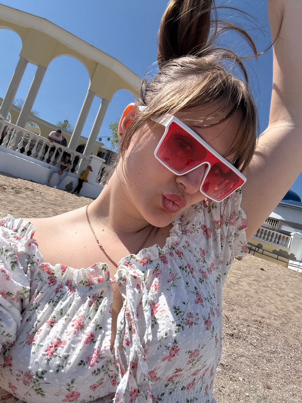 Woman takes selfie on Yevpatoriya beach in Ukraine