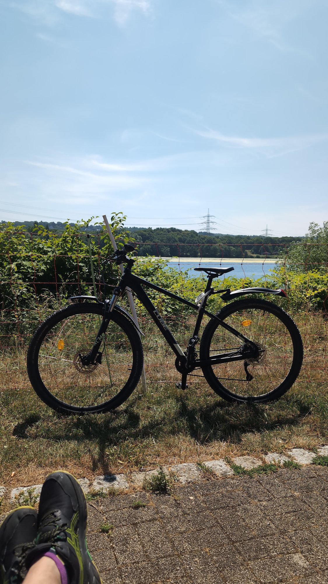 Lakeside stop in Bochum with a parked bike and open water views