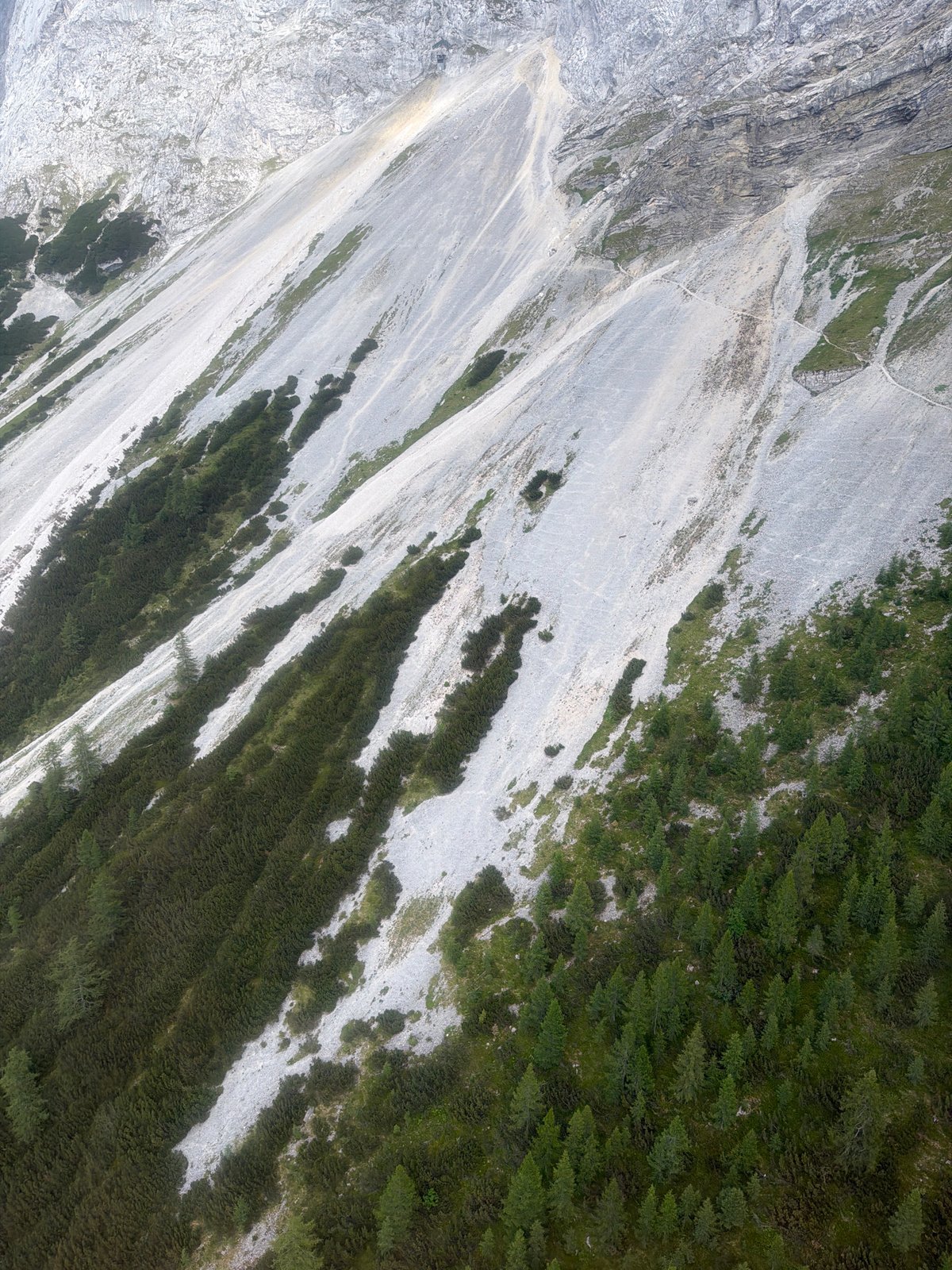 Rocky alpine terrain in Grainau, fog rolling across grey cliffs