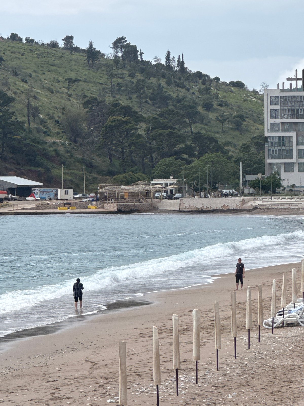 Beach activity observed in Miljevci, Montenegro under overcast skies