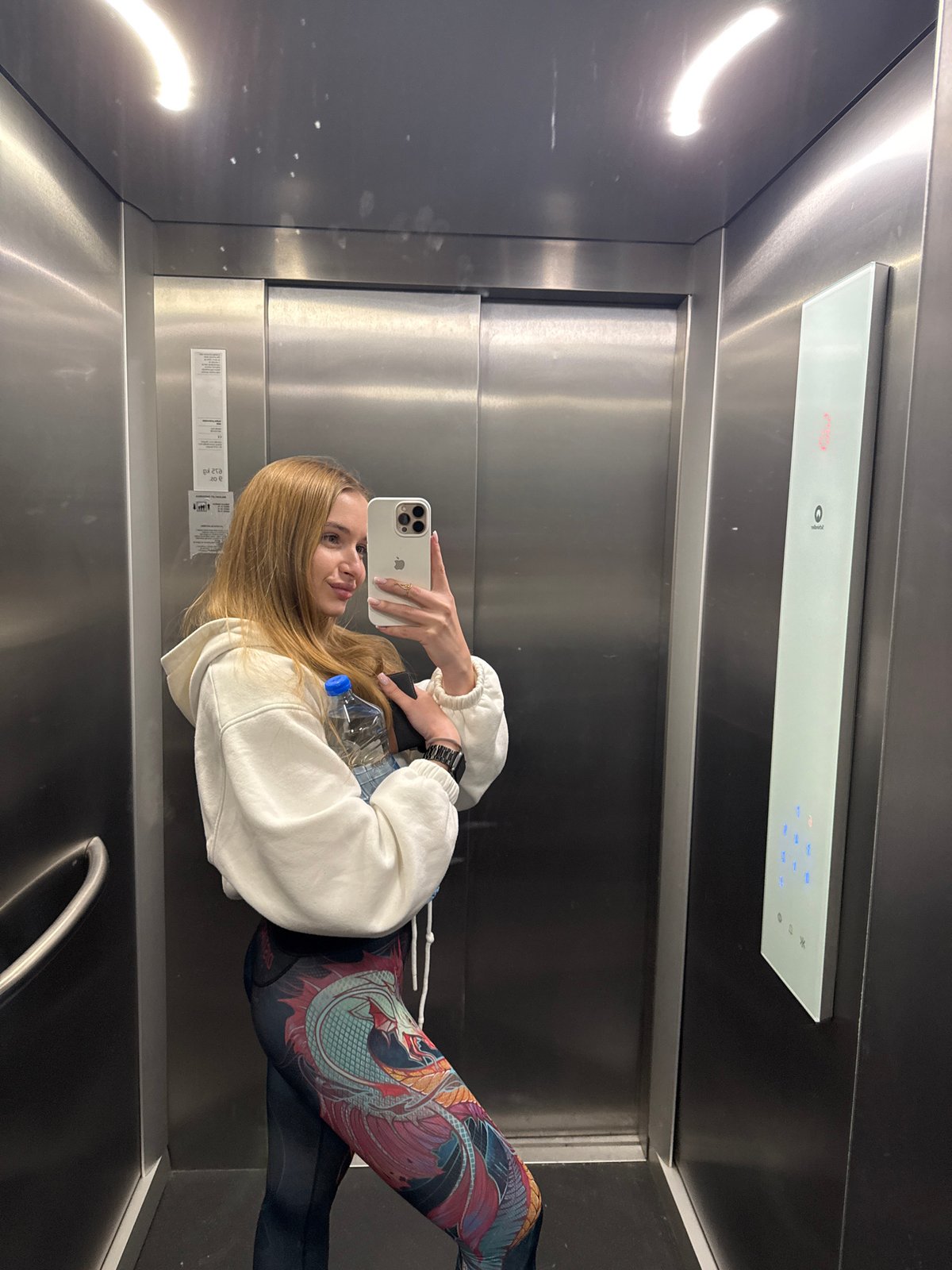 Woman takes elevator selfie in Budva, Montenegro