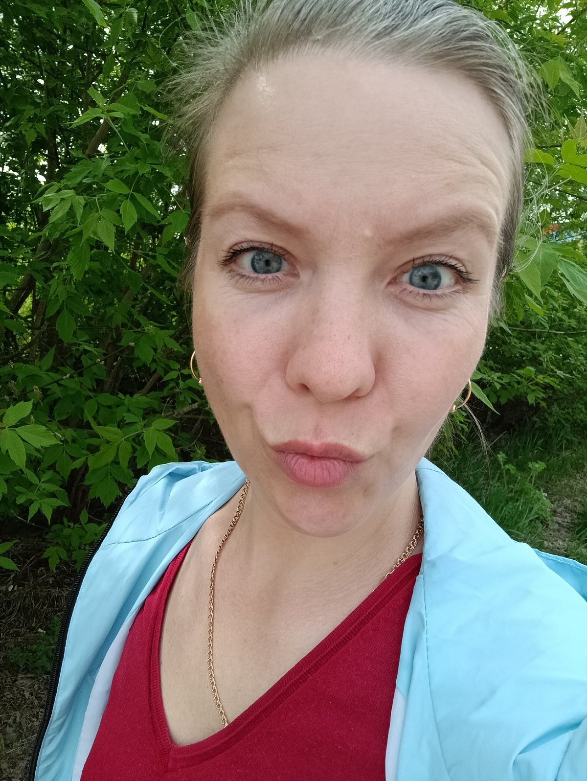 Woman documents spring morning with selfies and flower photography