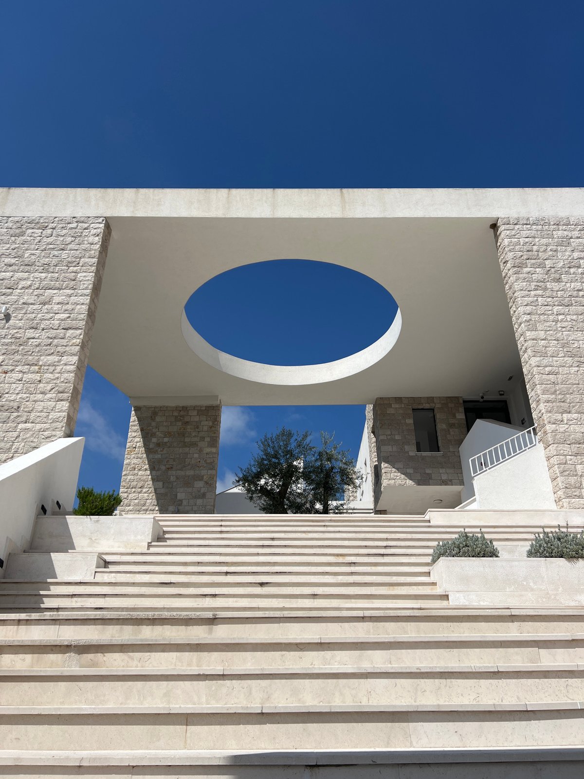Building with circular opening photographed in Stari Bar, Montenegro