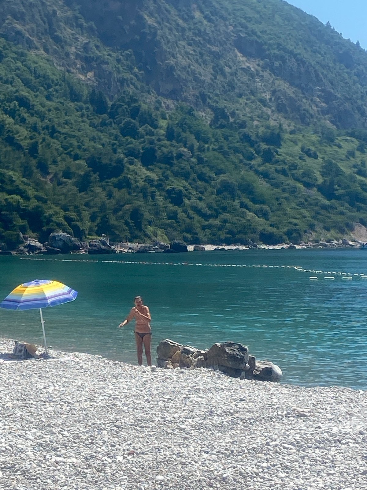 Peaceful morning beach activities documented at Montenegro coastal resort