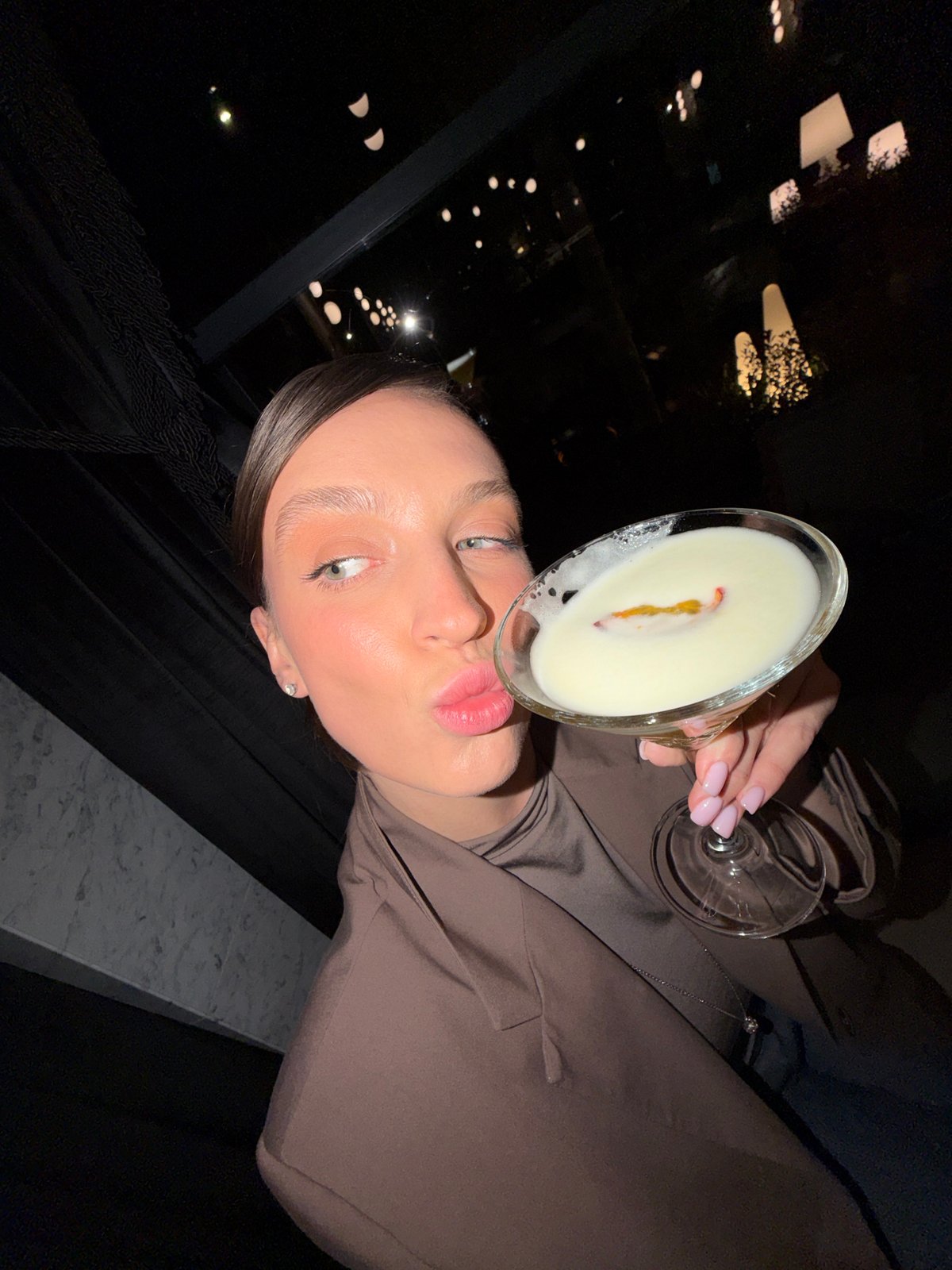 Woman enjoys cocktails at Budva establishment Saturday evening