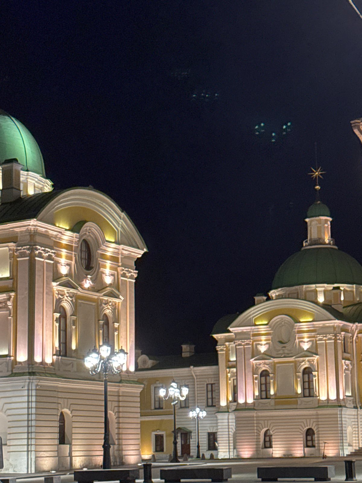 Illuminated domed building photographed at night in Tver, Russia