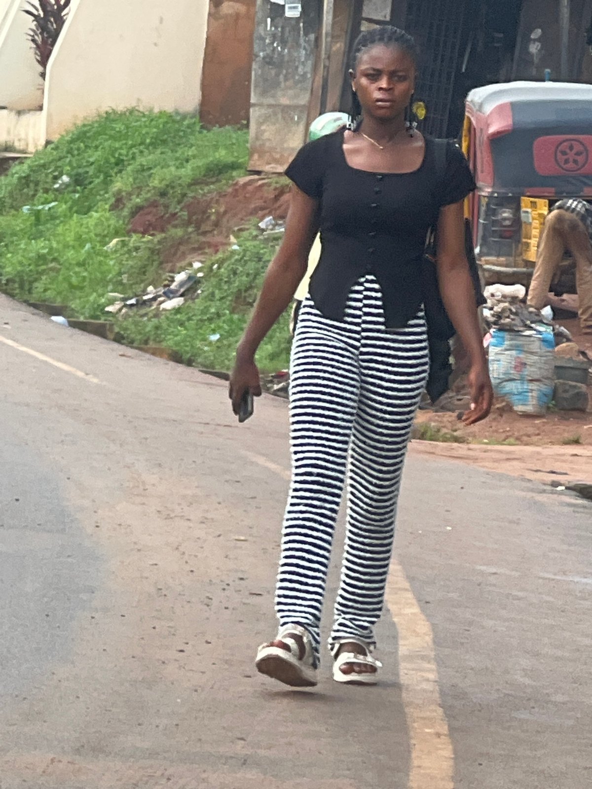 Morning street life and roadside repairs in Nkpor, Nigeria