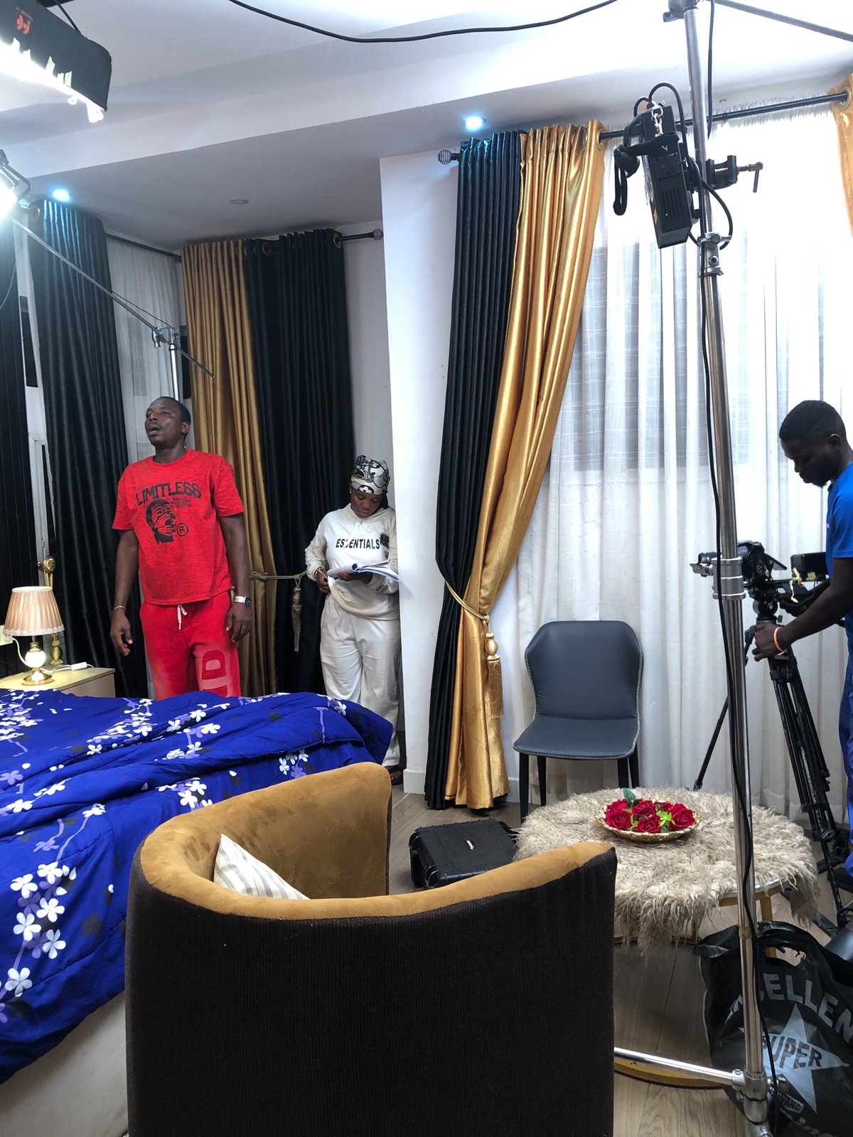 Professional film shoot documented in residential studio space