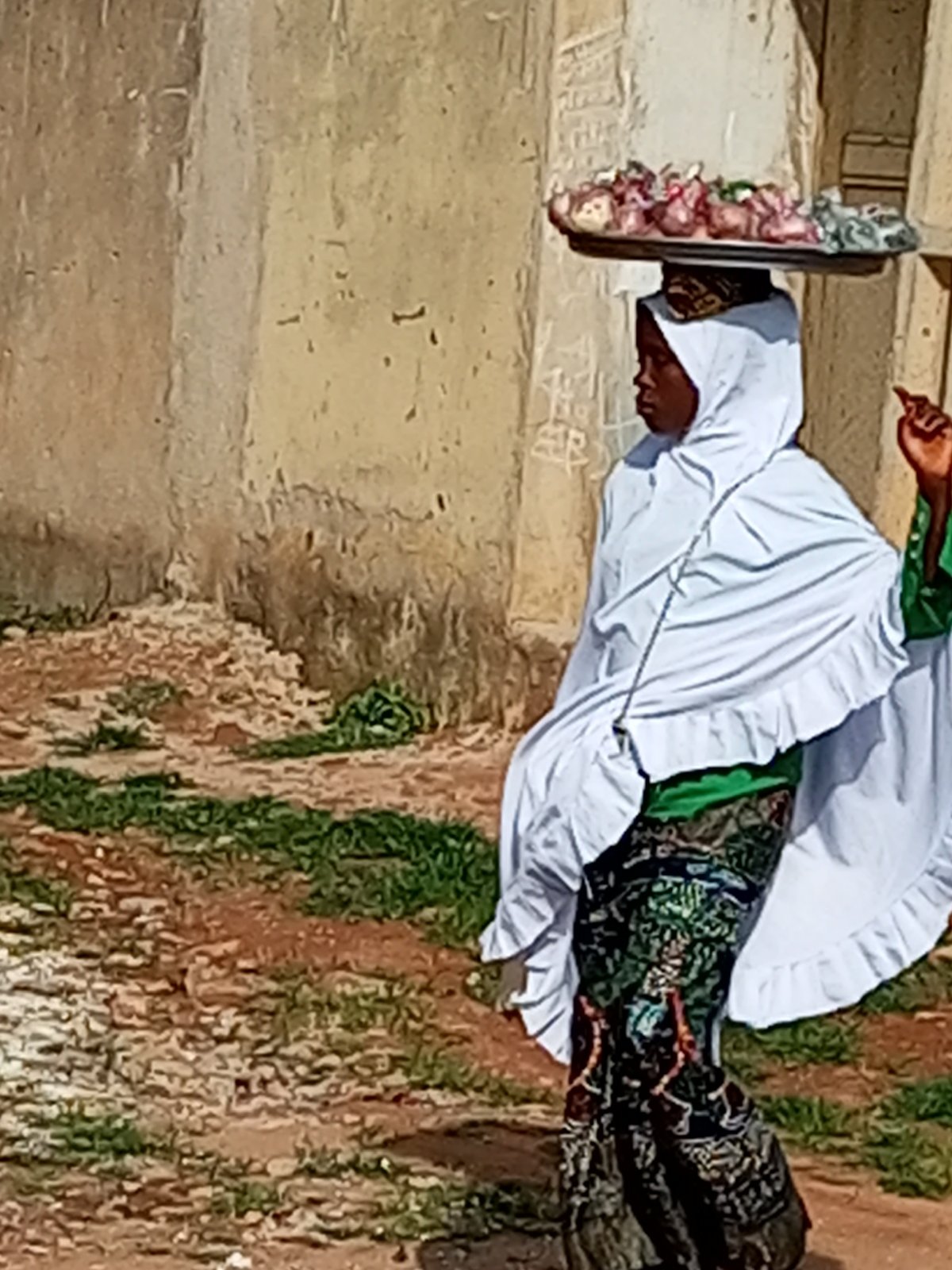Outdoor candid moments: tray-carrying and a direct-camera look