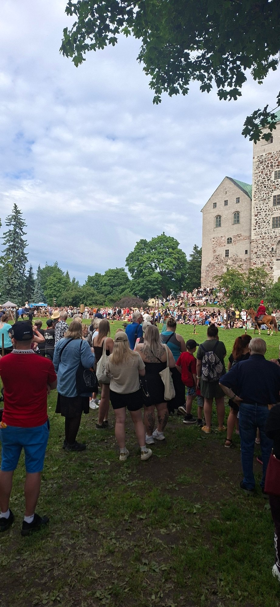 Medieval reenactment day at Turku Castle with markets and horseback riders