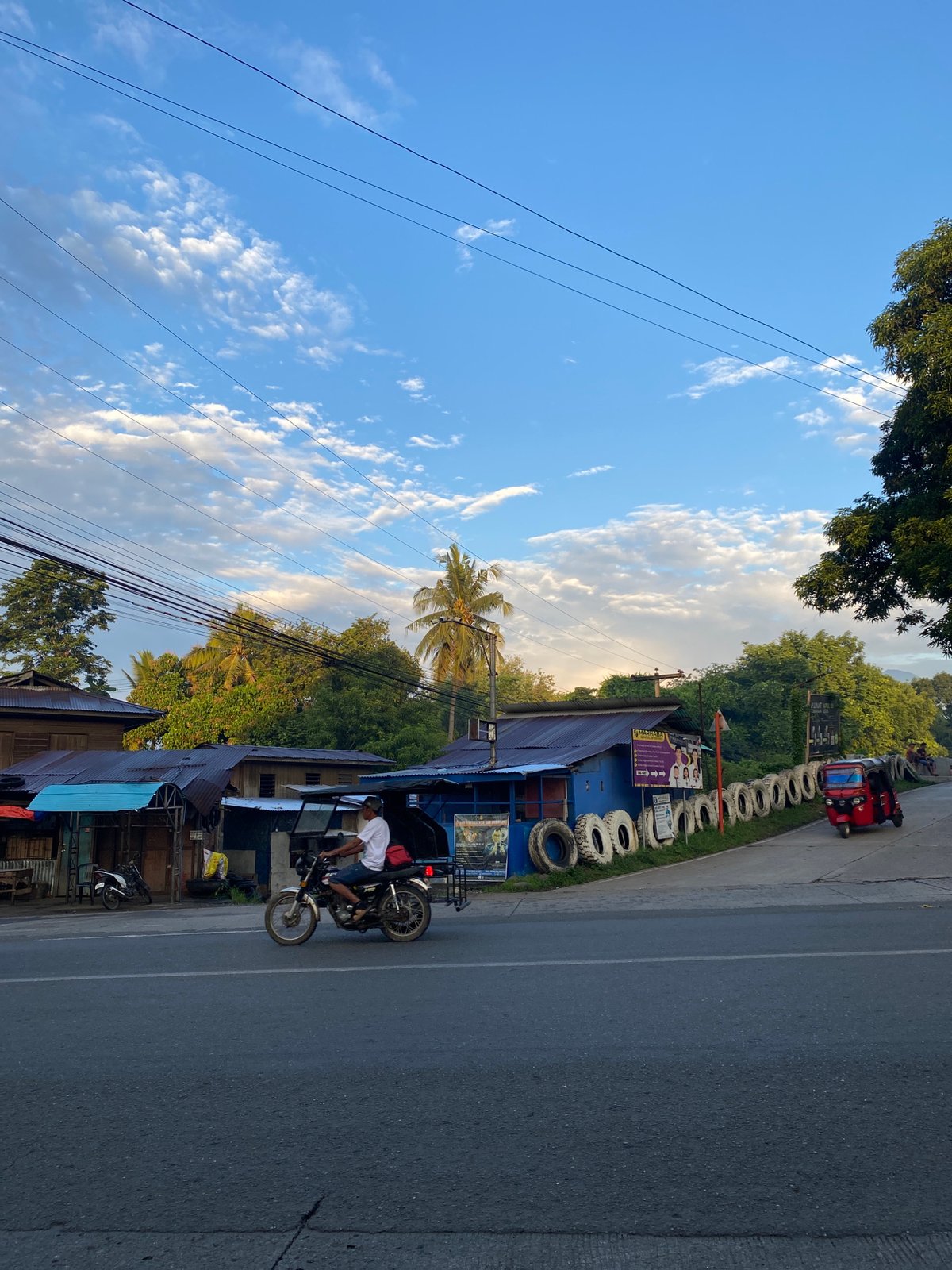 Davao City road corridor at golden hour, Crossing Bayabas
