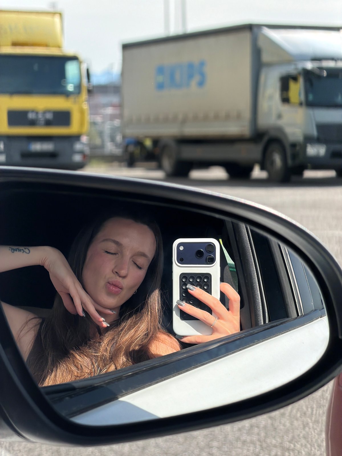 Woman takes selfies with dog in car, Montenegro