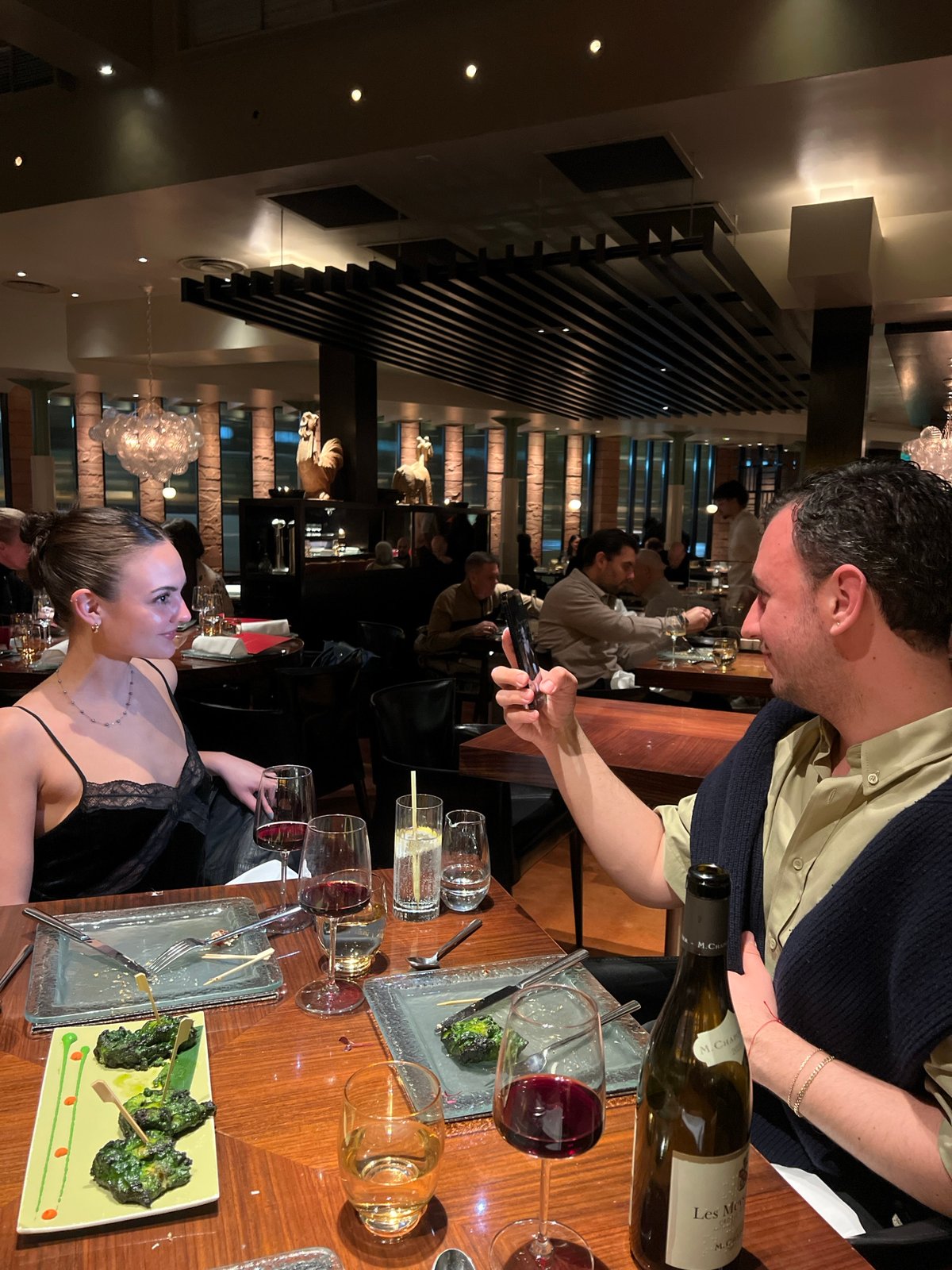 Couple photographs dinner at upscale London restaurant
