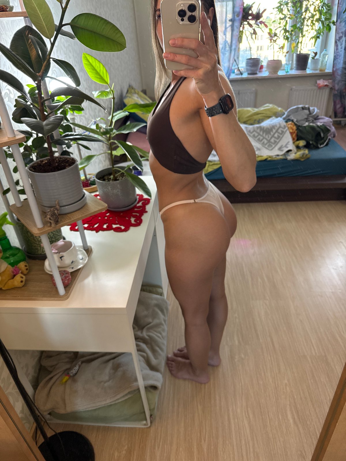 Woman takes mirror selfie sequence in Russian residence