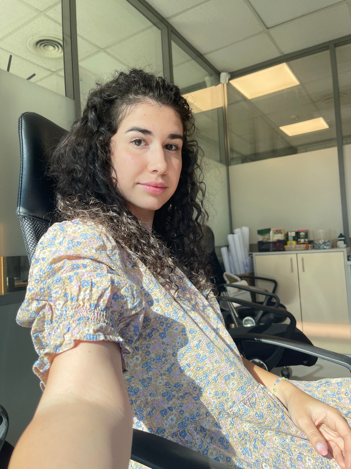 Woman's morning routine documented in Sofia office setting