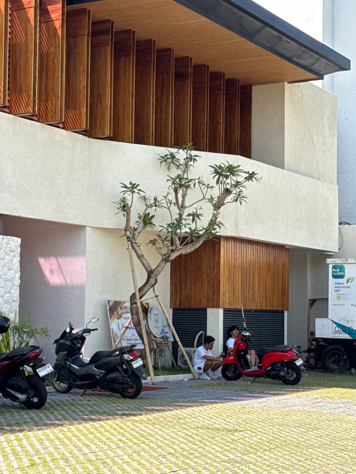 Ordinary street life documented across Kuta during sunny afternoon