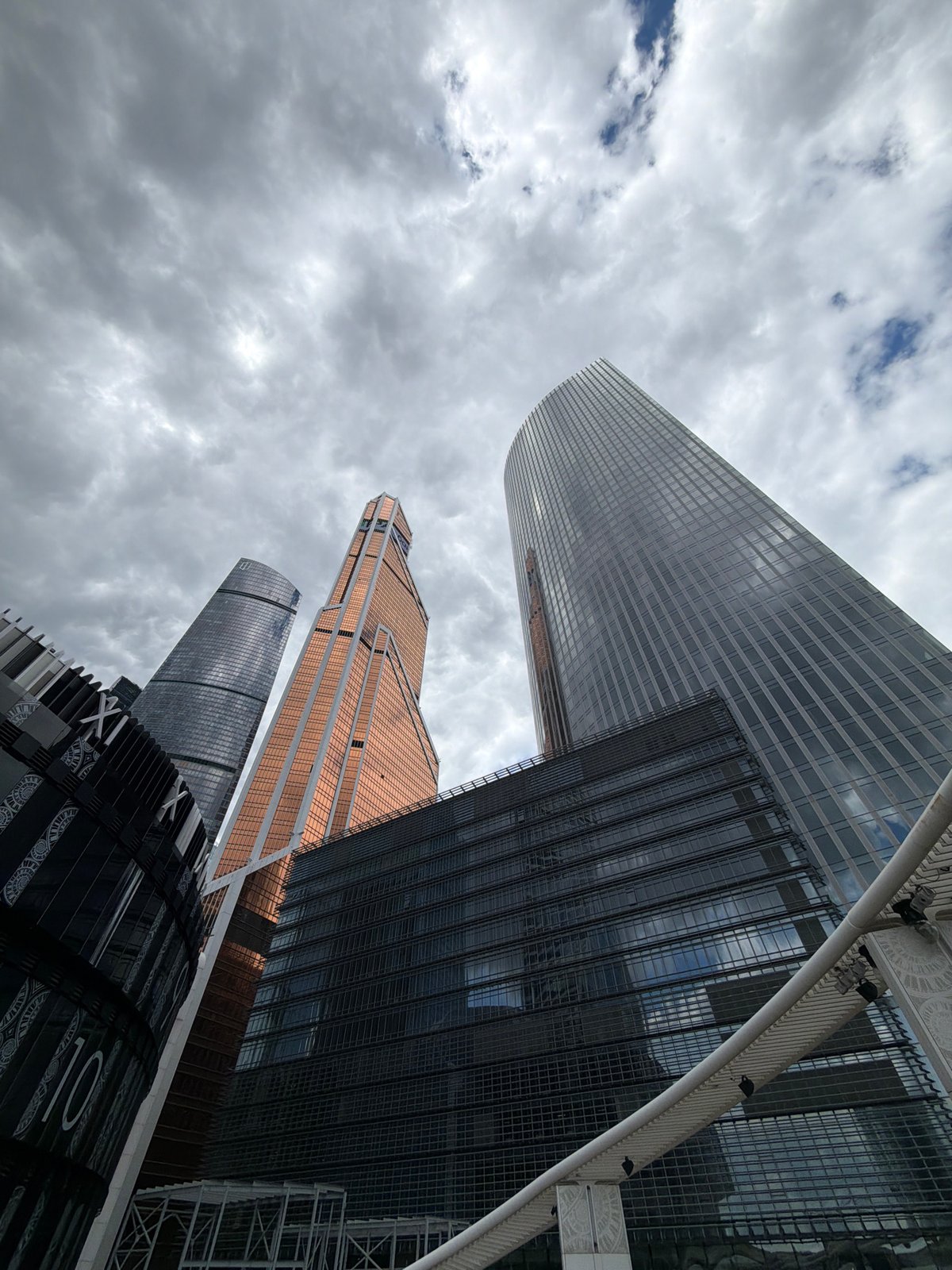Modern Moscow skyscrapers photographed under cloudy afternoon sky