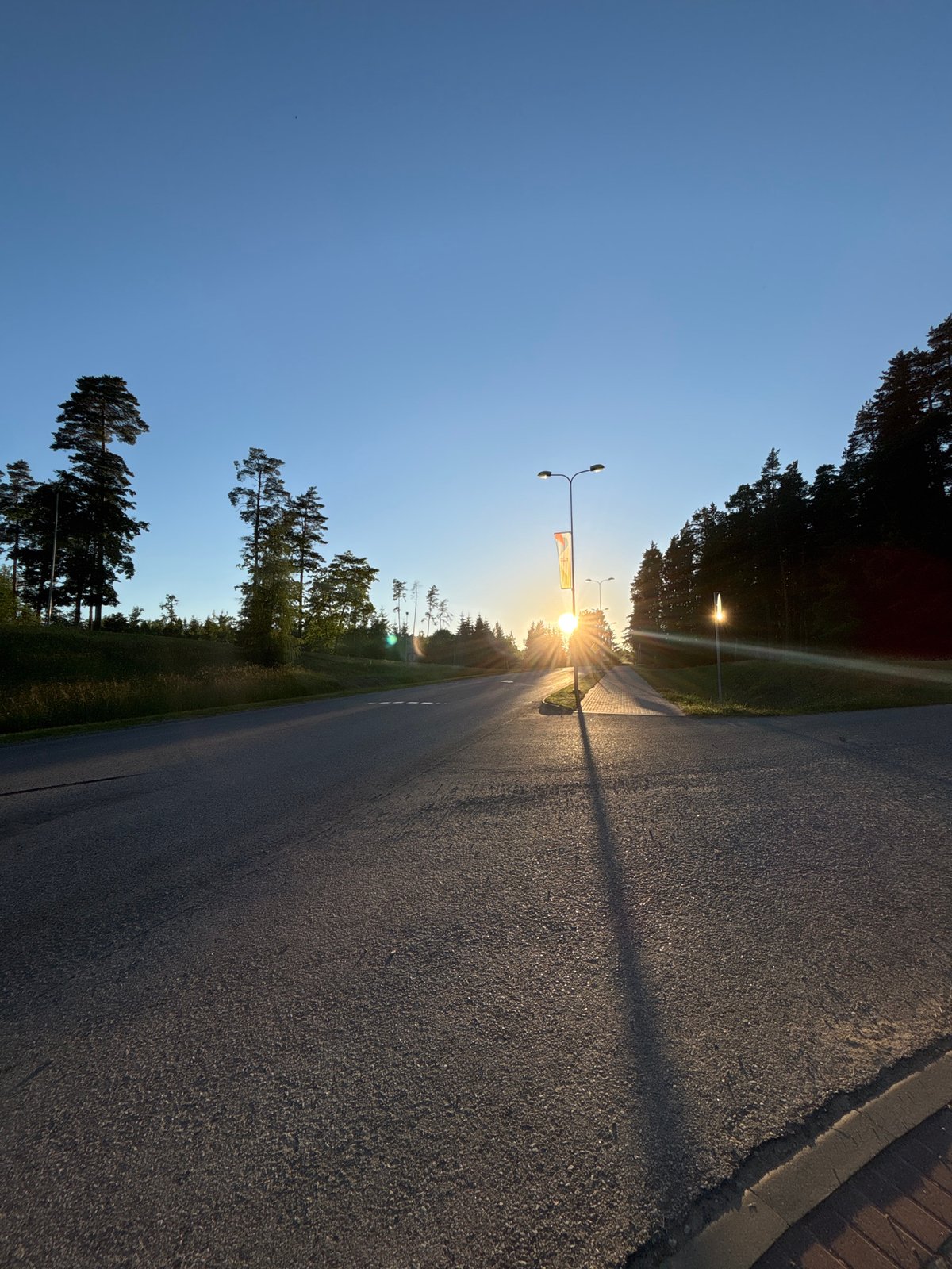 Evening stroll through Madona's tree-lined streets at golden hour