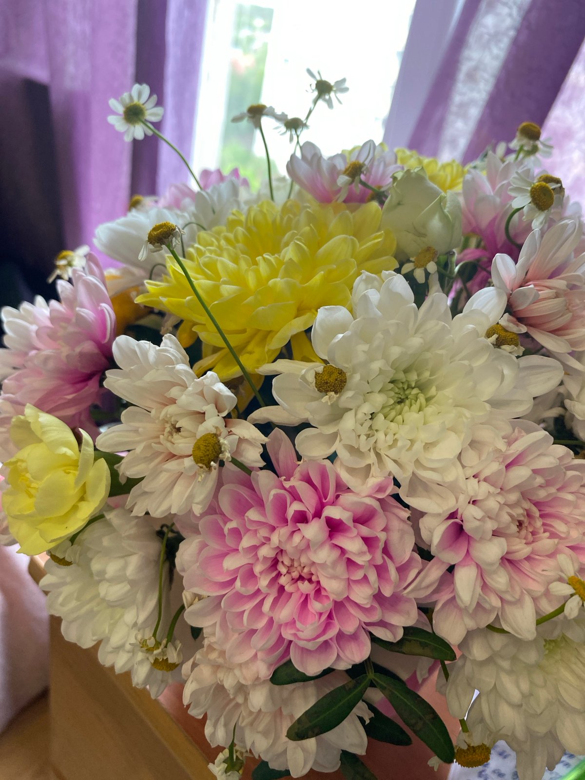 Young woman photographed with flowers in multiple settings