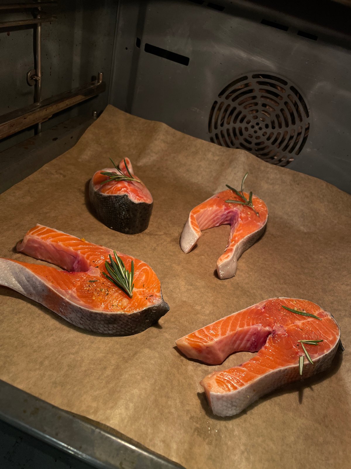 Moscow resident prepares salmon dinner with fresh salad
