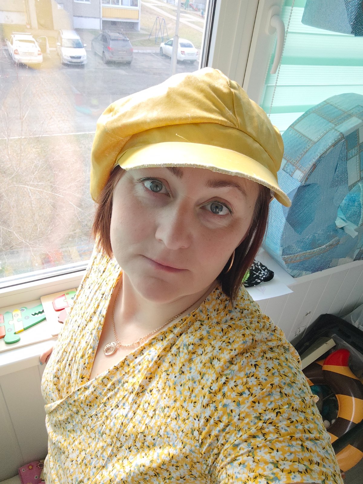 Woman in yellow floral outfit photographed in Markovskii