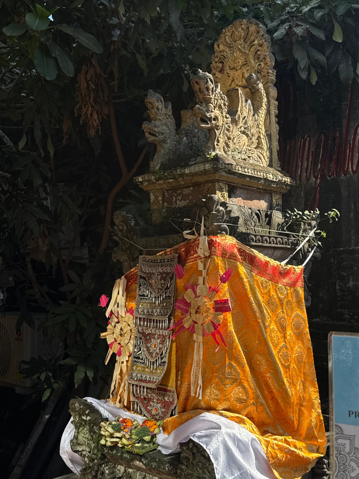 Macaques and temple statues at a Ubud sacred site