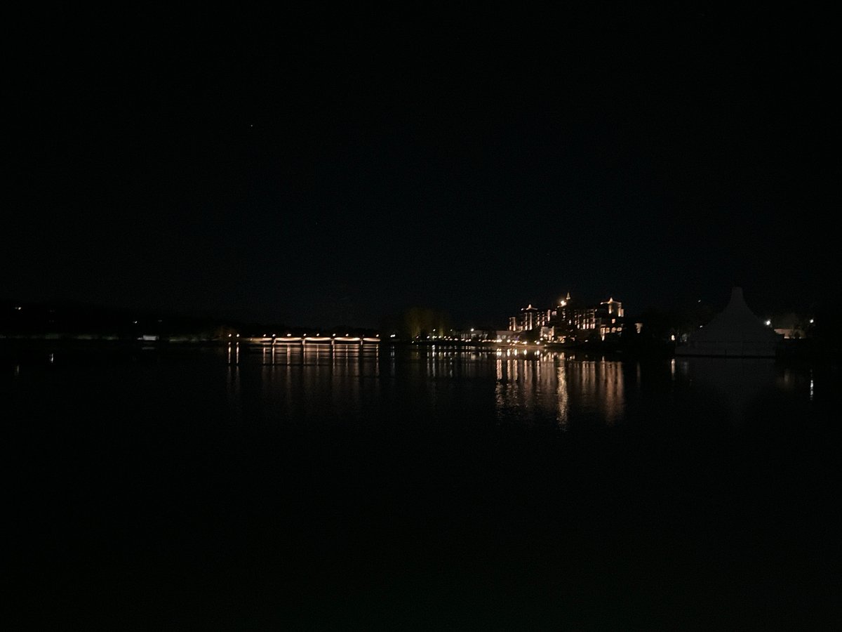 Nighttime scenes captured in Pravets, Bulgaria show waterfront buildings, city entrance