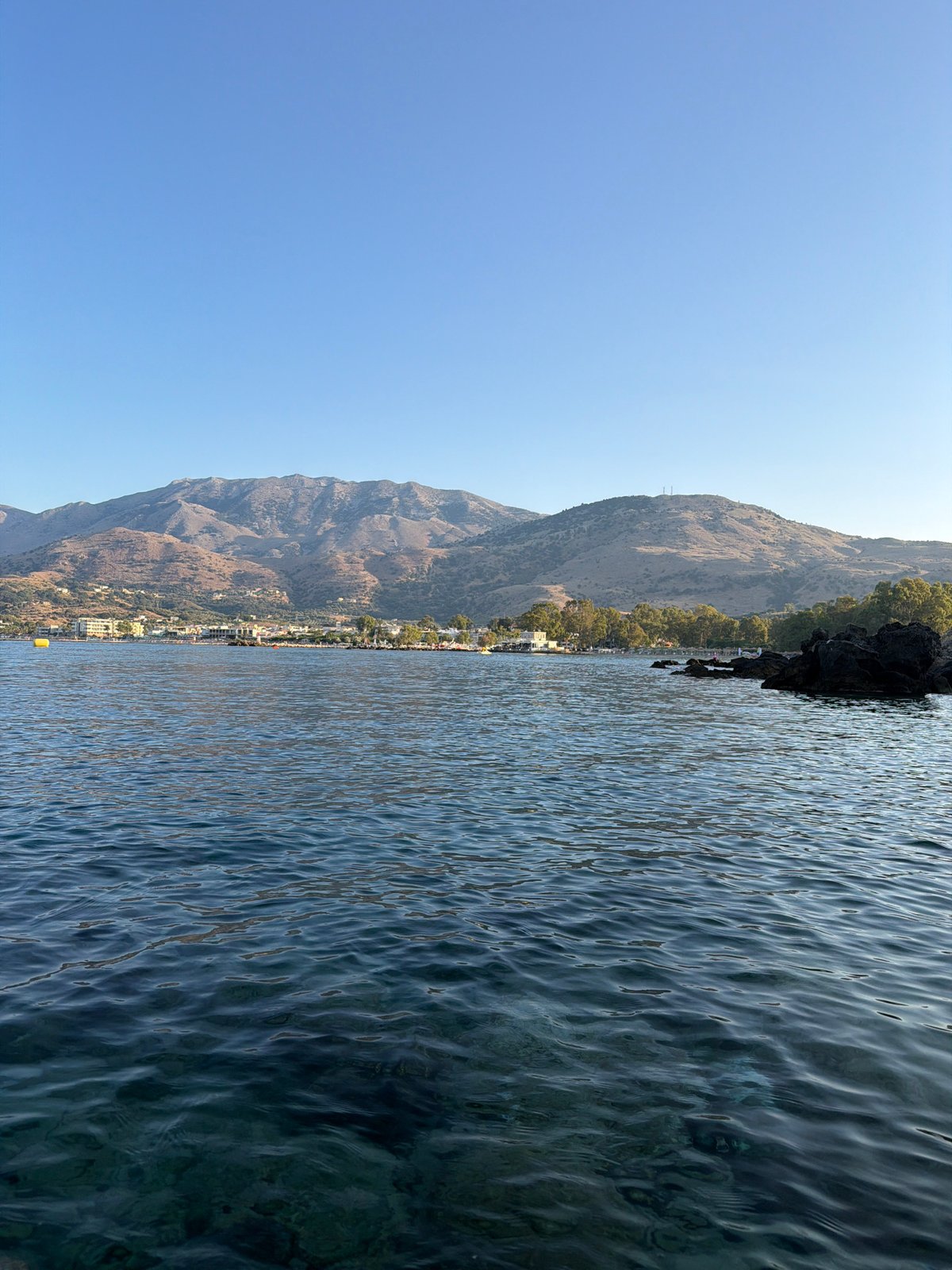Georgioupoli at golden hour: beach, promenade, and town