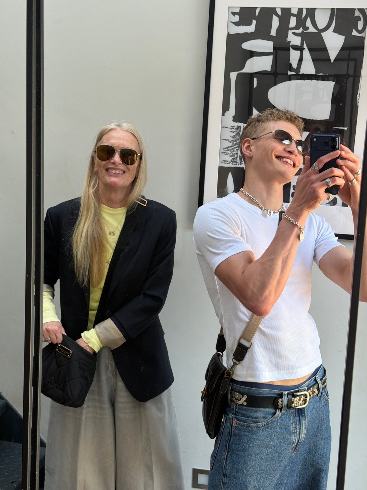 Mirror selfie captured between young man and older woman in London