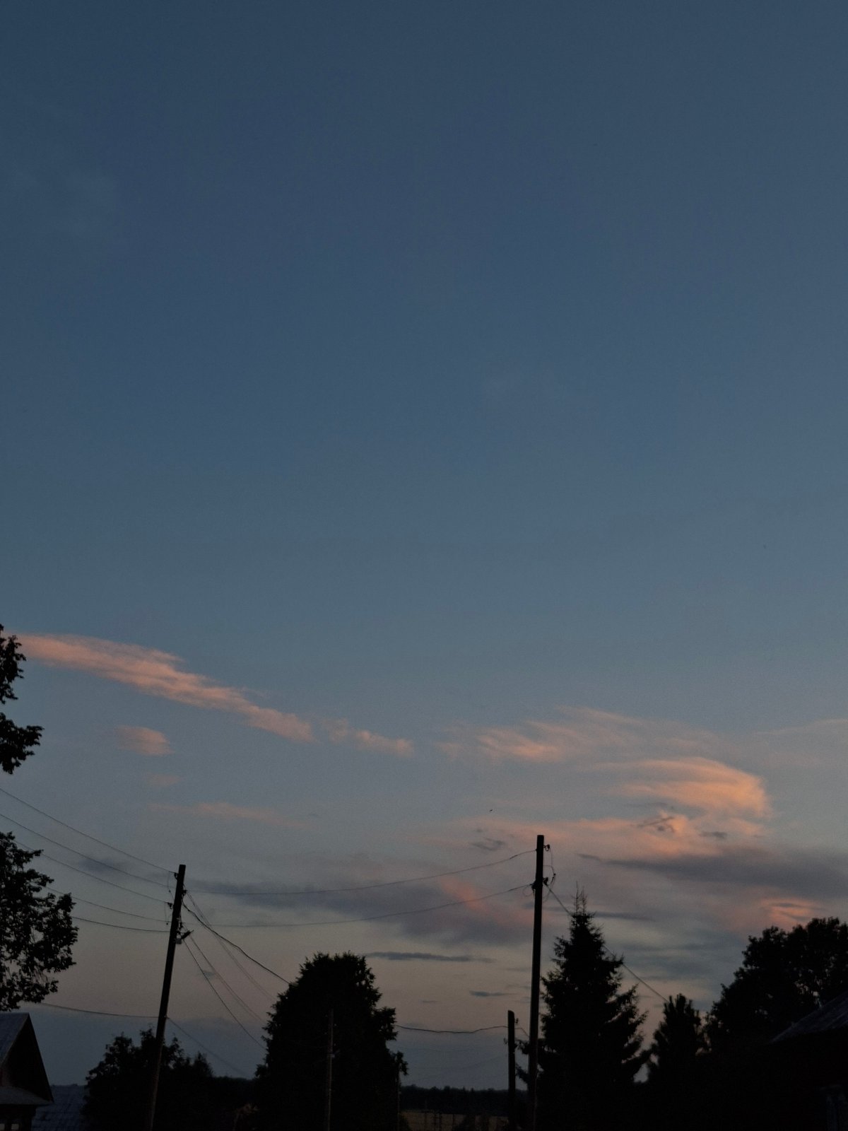 Backyard afternoon: dusk skies, a deck, and apple snack time.
