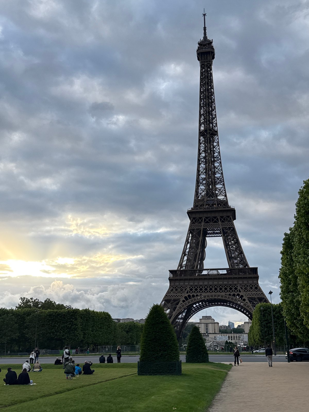 Eiffel Tower photographed against cloudy Paris sky