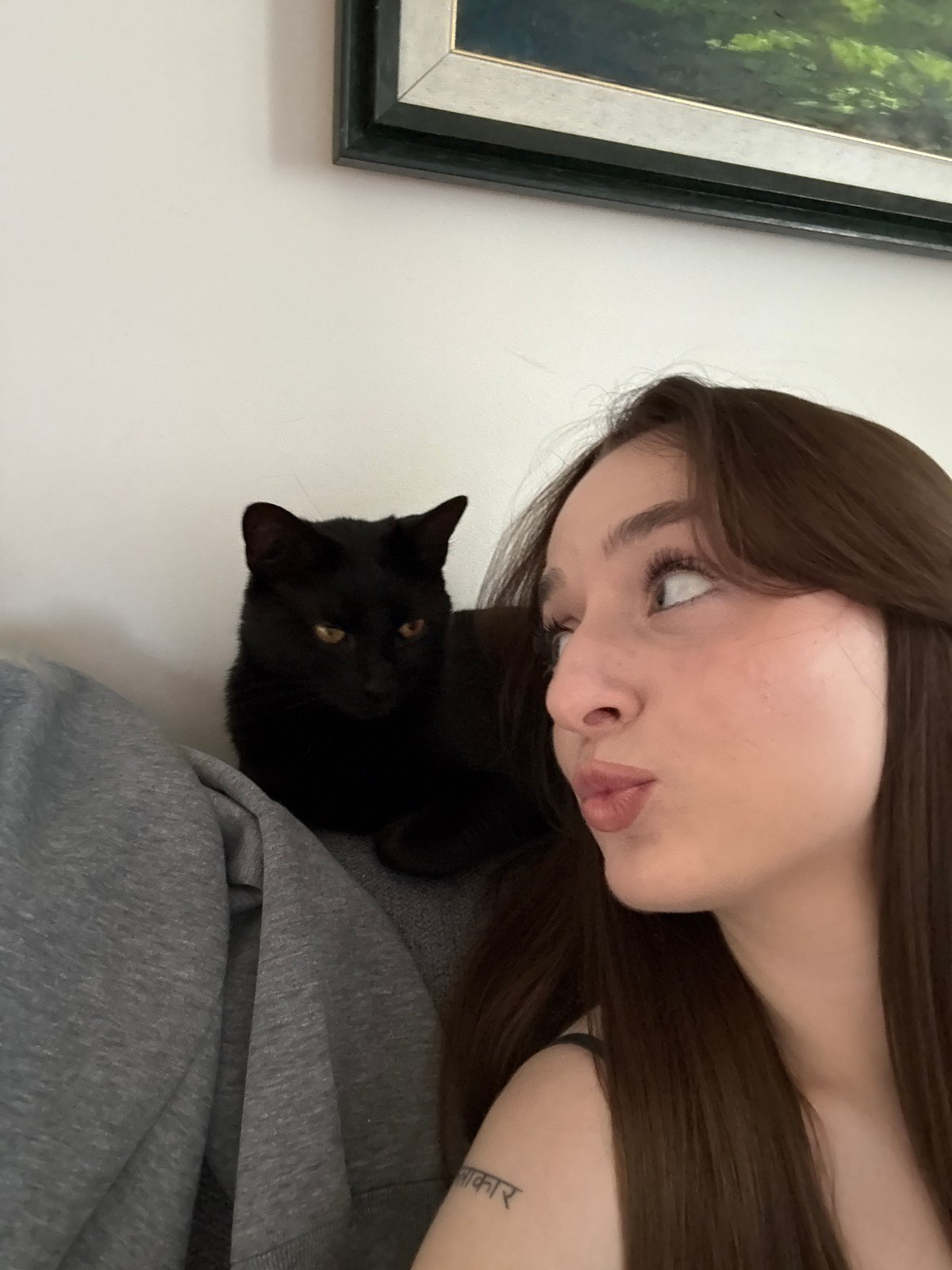 Woman and black cat photographed together in Belgrade suburb