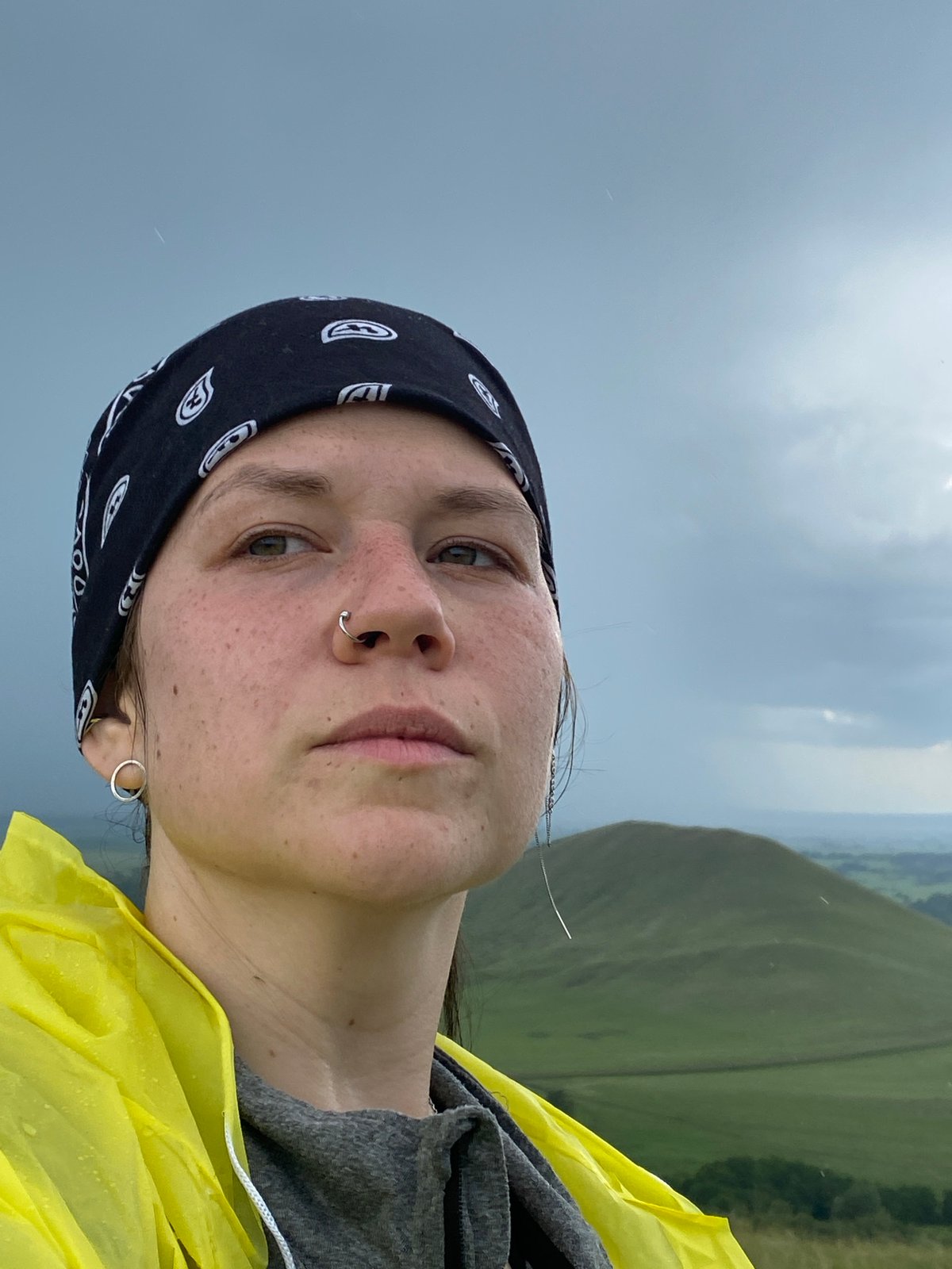 Hillside hiking break in Рыскулово with yellow raincoat selfies