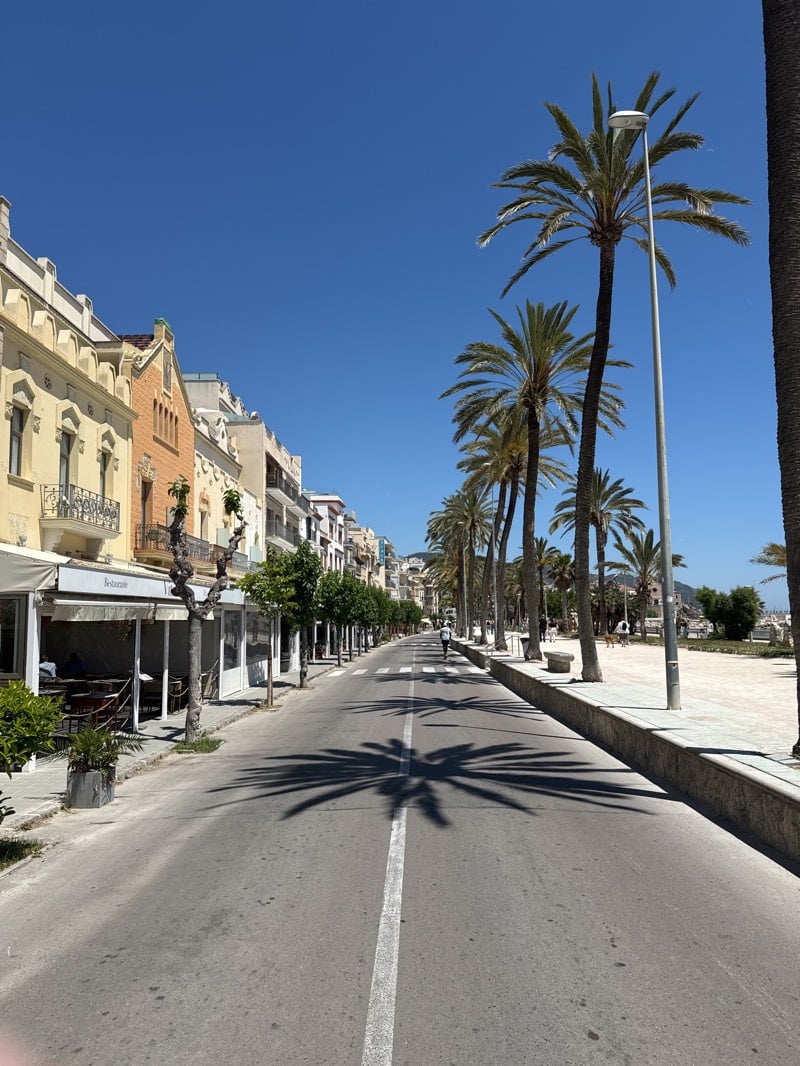 Midday street life documented in coastal Sitges, Spain