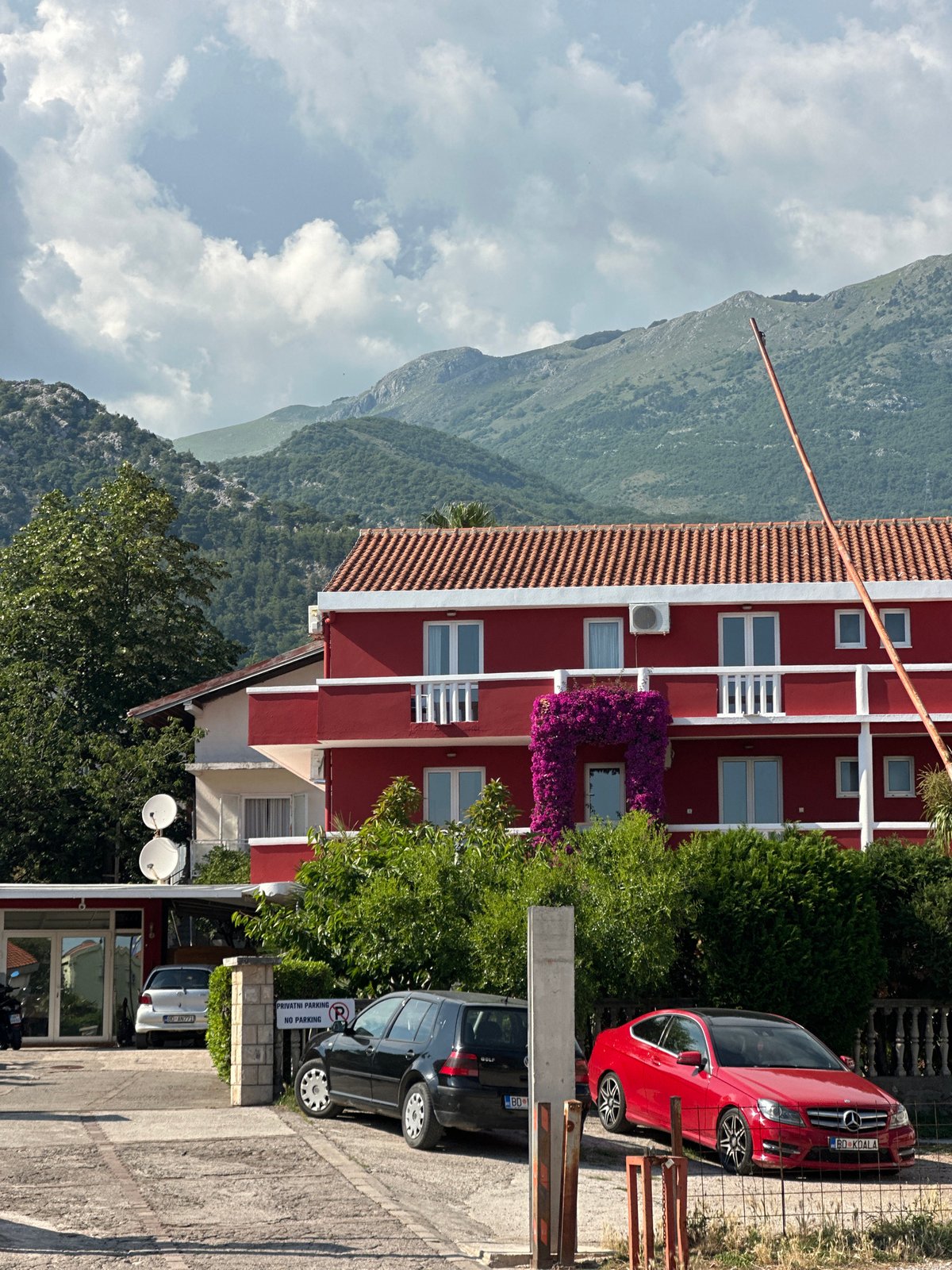 Tourist documents afternoon stroll through Budva, Montenegro