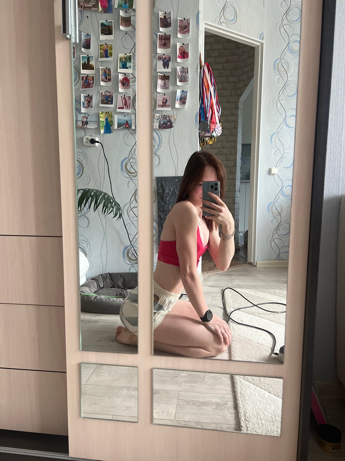 Woman takes mirror selfies with cat in Russian apartment
