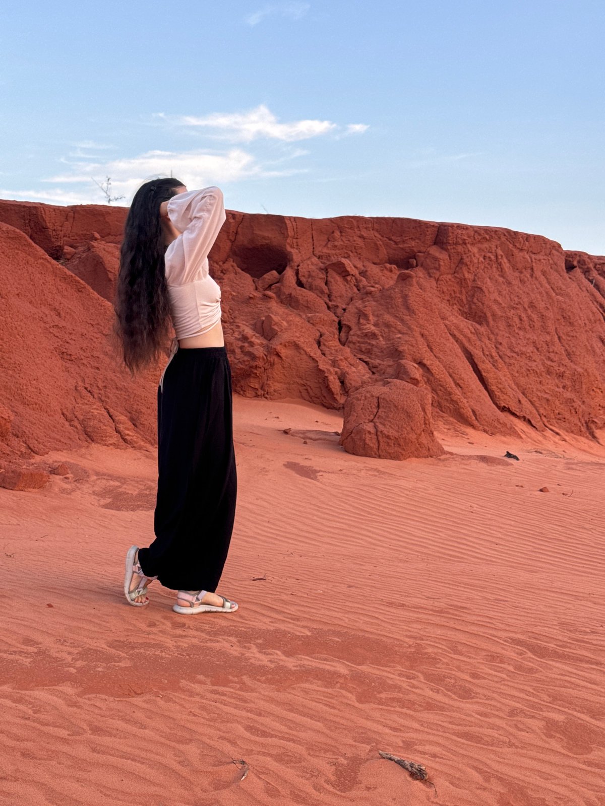 Tourist photoshoot at Mui Ne Red Sand Dunes features playful poses