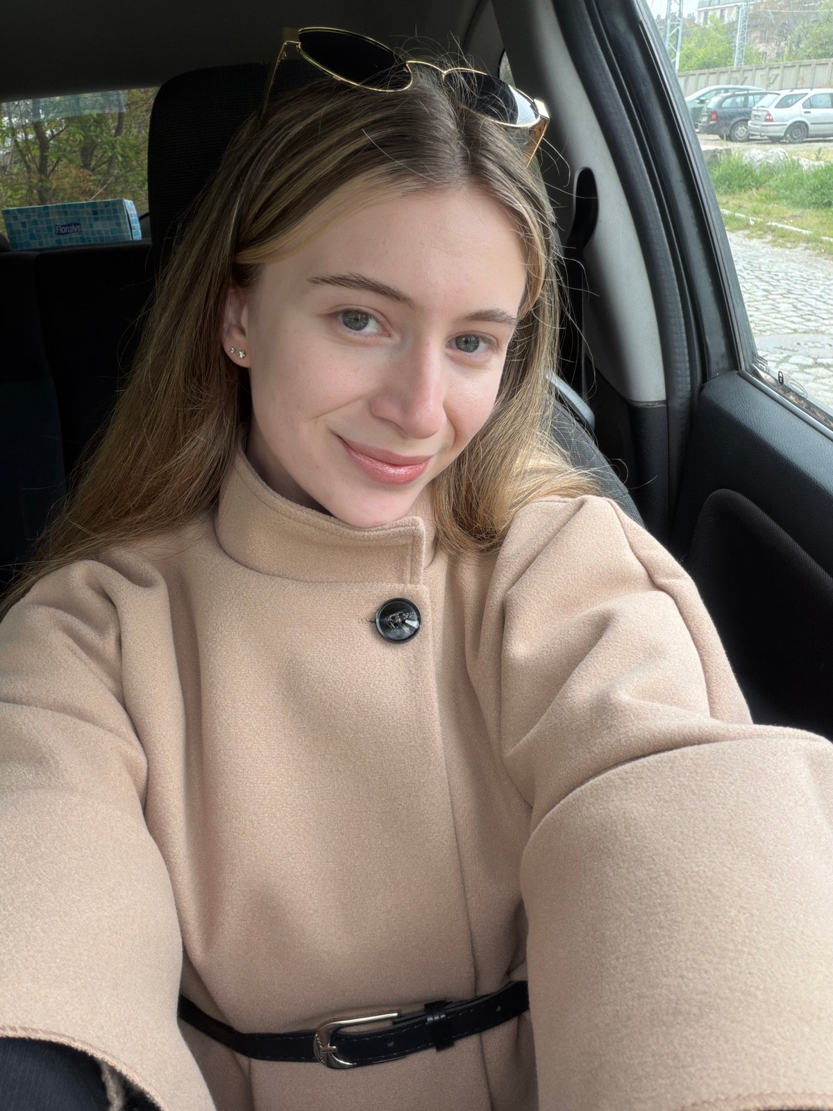 Woman takes selfies in car in Plovdiv, Bulgaria