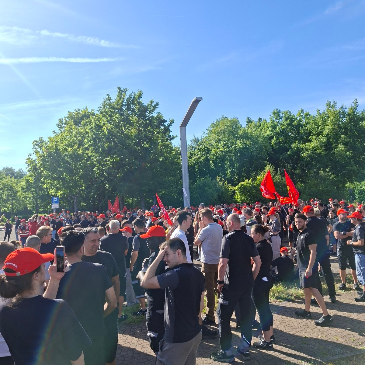 Red-clad crowd rallies outdoors in Rastatt, Germany